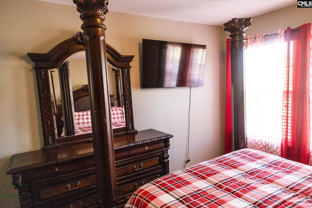 bedroom featuring multiple windows