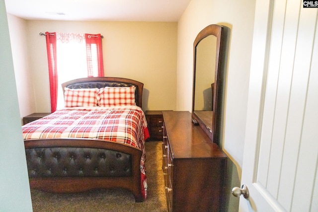 bedroom featuring visible vents and carpet