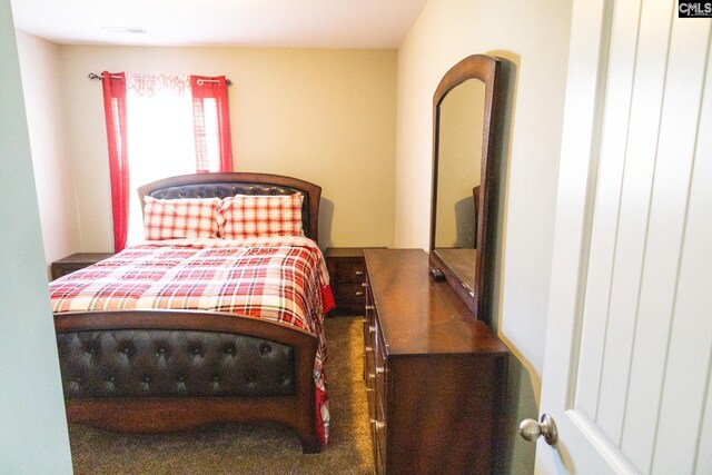 bedroom featuring visible vents and carpet