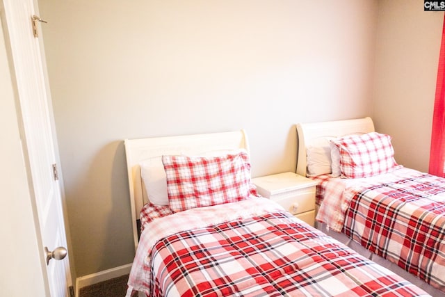 carpeted bedroom with baseboards