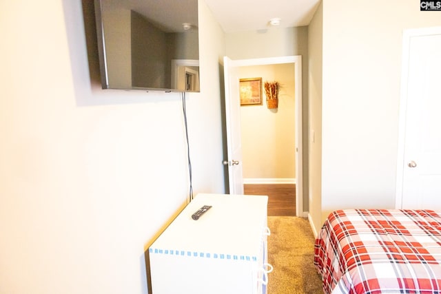 carpeted bedroom featuring baseboards