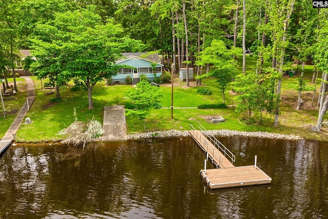 dock area featuring a water view and a yard