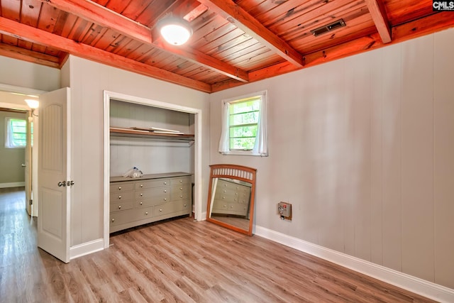 interior space with beam ceiling, wood ceiling, and light wood finished floors