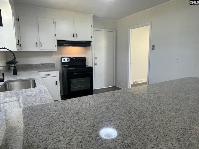 kitchen featuring ornamental molding, black electric range oven, under cabinet range hood, white cabinets, and a sink