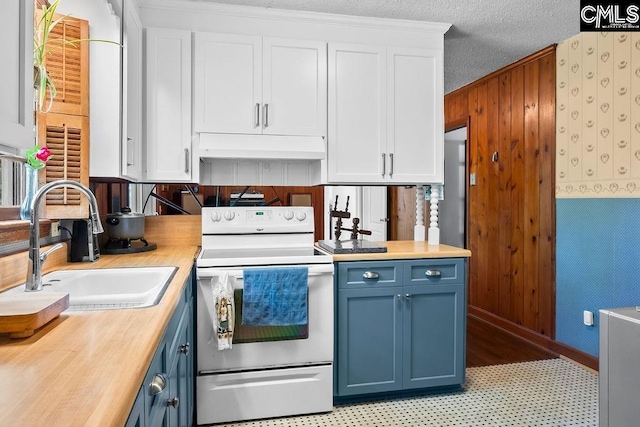 kitchen with a sink, white electric range, under cabinet range hood, white cabinets, and blue cabinets