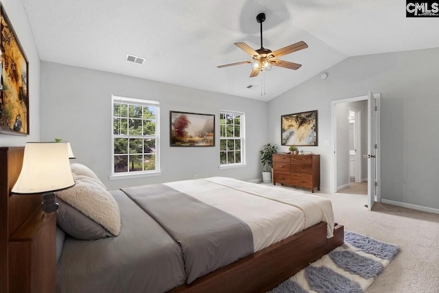 bedroom featuring visible vents, a ceiling fan, lofted ceiling, baseboards, and carpet flooring