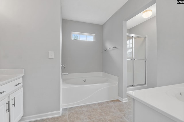 full bath with vanity, baseboards, a stall shower, and a bath