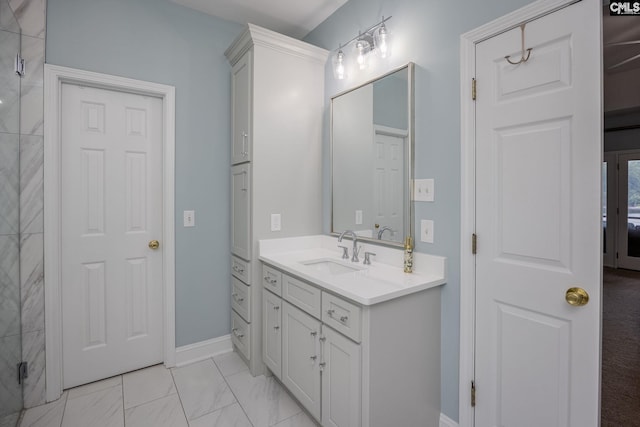 full bath with vanity, marble finish floor, a shower with shower door, and baseboards