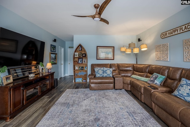 living room with a ceiling fan and dark wood-style flooring