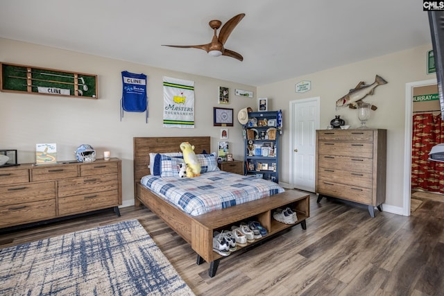 bedroom with baseboards, ceiling fan, and wood finished floors