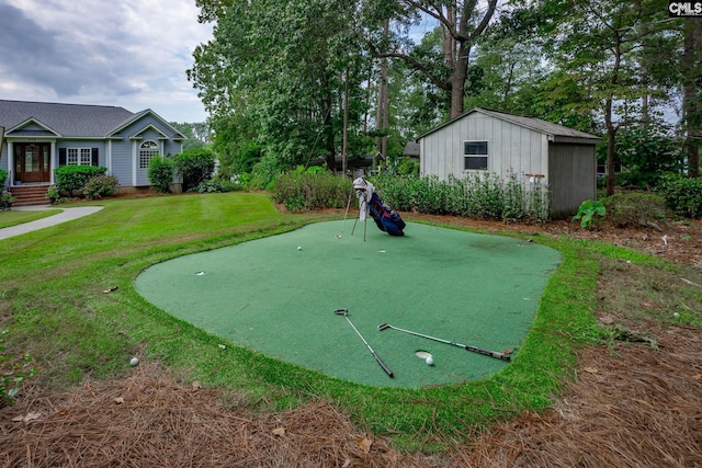 view of home's community with a yard and an outbuilding