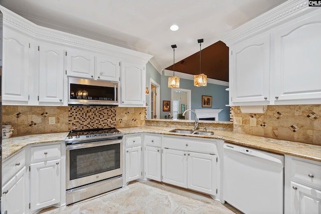 kitchen with crown molding, white cabinetry, appliances with stainless steel finishes, and a sink