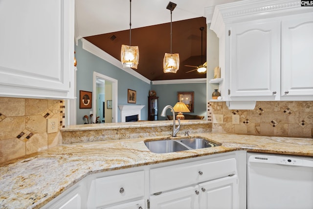 kitchen with a sink, a fireplace, dishwasher, a ceiling fan, and ornamental molding