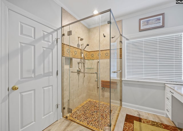 full bath with ornamental molding and a shower stall