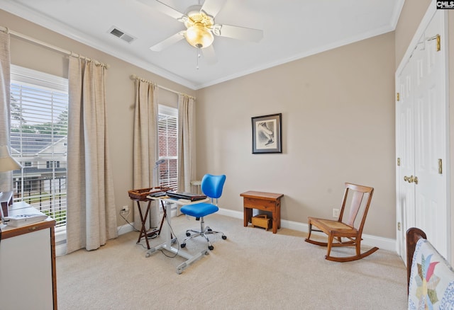 carpeted home office with a ceiling fan, baseboards, visible vents, and ornamental molding