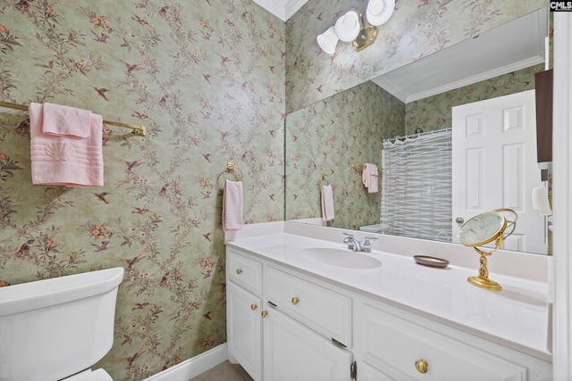 bathroom with vanity, crown molding, toilet, baseboards, and a shower with shower curtain