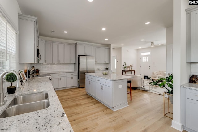 12 Magnolia Bay Ct, Columbia, SC 29229 - kitchen featuring a sink, appliances with stainless steel finishes, light wood-type flooring, a kitchen island, and recessed lighting