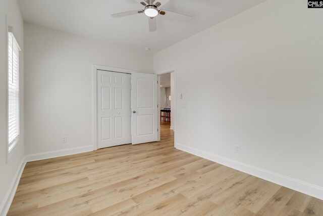 12 Magnolia Bay Ct, Columbia, SC 29229 - unfurnished bedroom featuring baseboards, light wood-style floors, and multiple windows