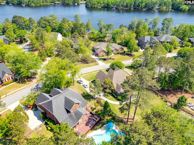 birds eye view of property with a water view and a residential view