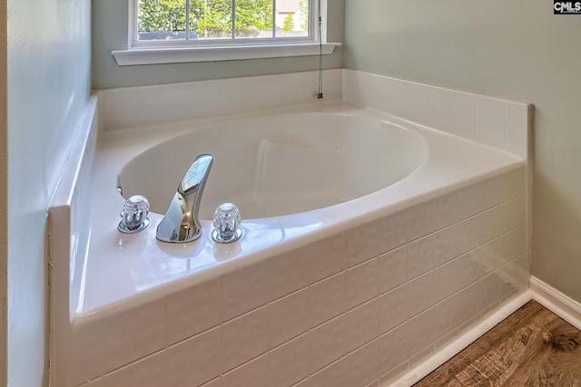 full bathroom with a bath