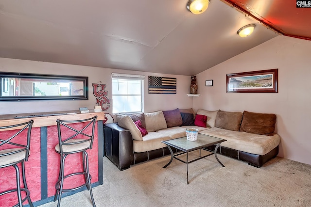 living area featuring carpet flooring and lofted ceiling