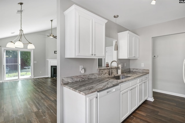 kitchen featuring dark wood-style flooring, white dishwasher, a sink, a ceiling fan, and baseboards