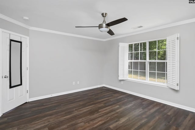 spare room with crown molding, baseboards, ceiling fan, and wood finished floors