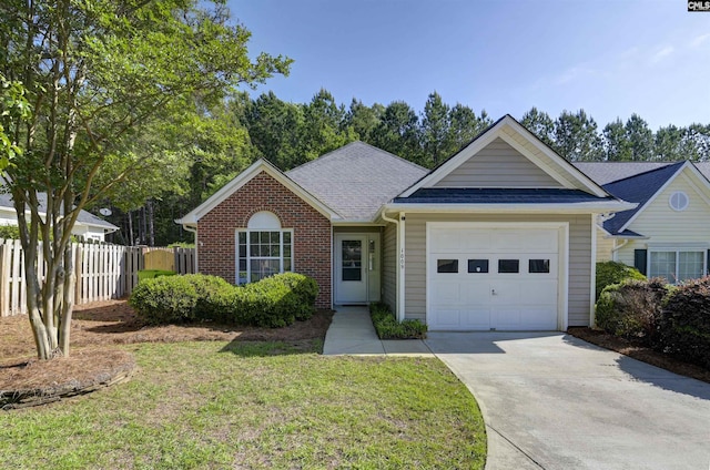 single story home with fence, roof with shingles, an attached garage, a front lawn, and driveway