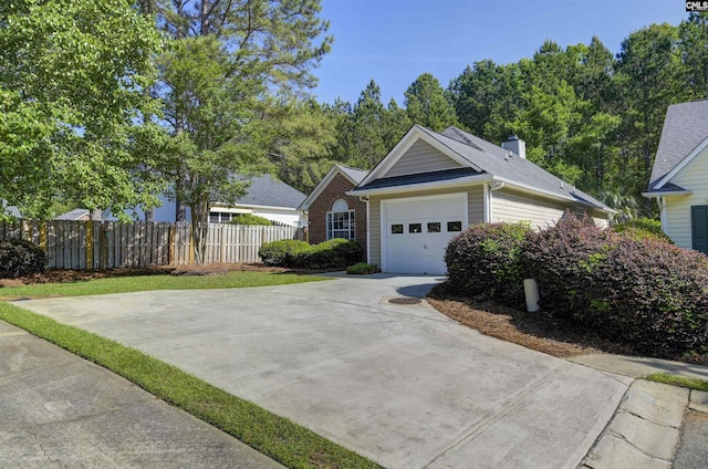single story home with fence, driveway, a chimney, and a garage