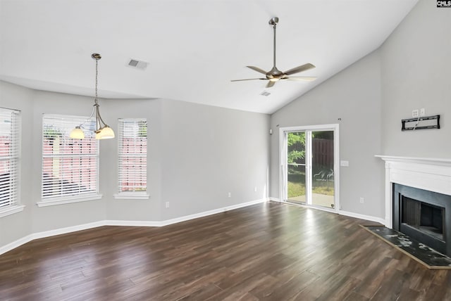 unfurnished living room featuring a fireplace with flush hearth, ceiling fan, visible vents, and dark wood-type flooring
