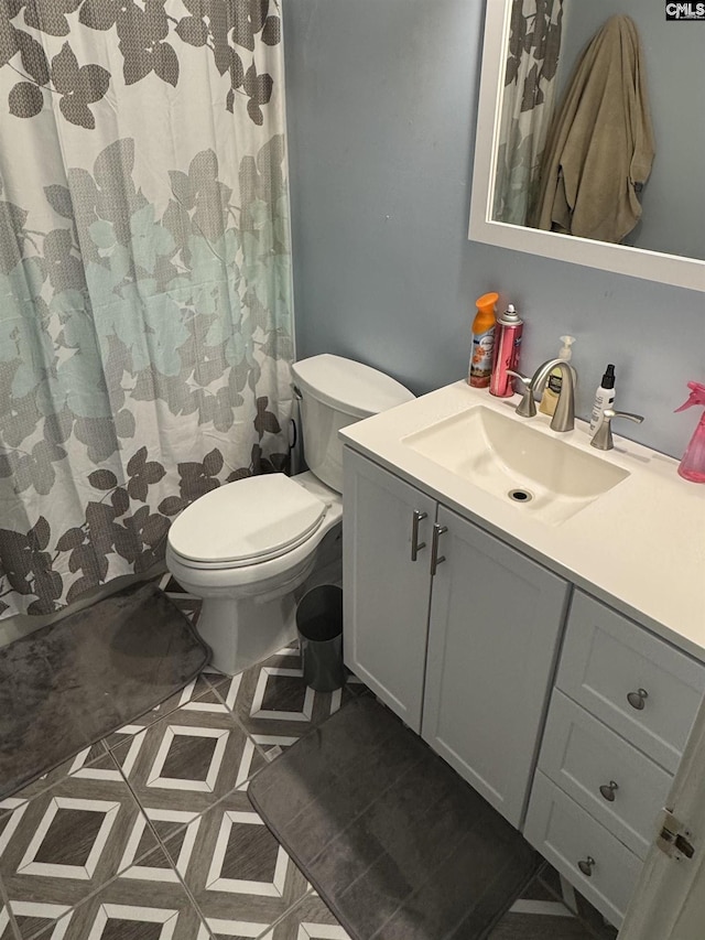 40 Turn Row Ct, Sumter, SC 29154 - bathroom with toilet, vanity, and a shower with curtain