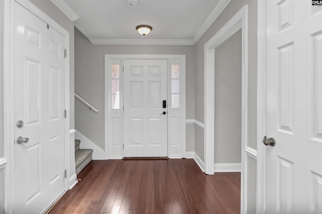 foyer featuring stairs, baseboards, dark wood finished floors, and ornamental molding