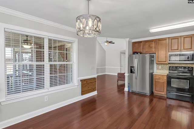 kitchen featuring appliances with stainless steel finishes, light countertops, ceiling fan with notable chandelier, tasteful backsplash, and dark wood-type flooring