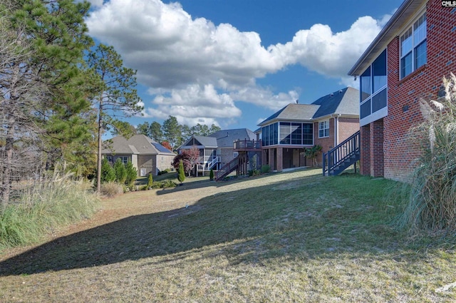 view of yard with stairs and a residential view