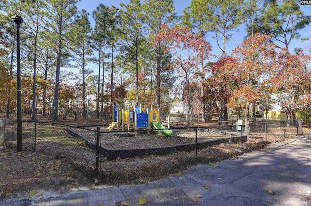 communal playground featuring fence