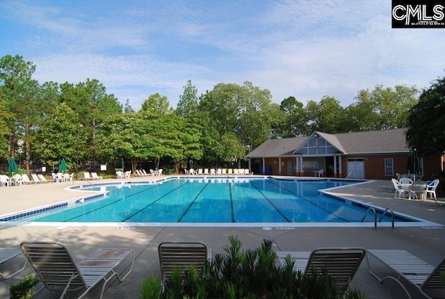 pool with a patio