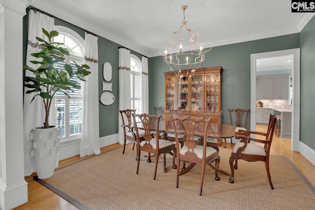 119 Ashley Trace Dr, Lexington, SC 29072 - dining room with crown molding, light wood-style flooring, and a chandelier
