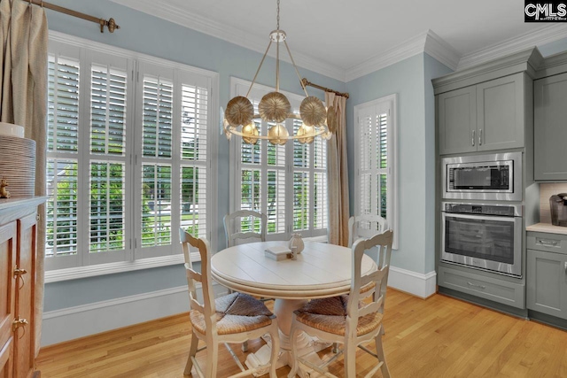 119 Ashley Trace Dr, Lexington, SC 29072 - dining room with baseboards, a notable chandelier, ornamental molding, and light wood-style flooring