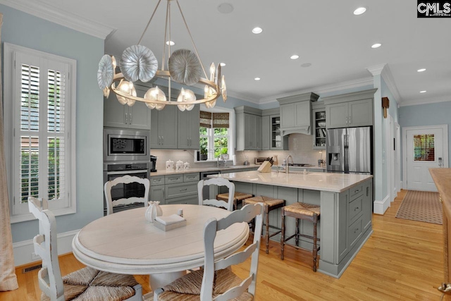 119 Ashley Trace Dr, Lexington, SC 29072 - kitchen with light countertops, backsplash, appliances with stainless steel finishes, and gray cabinetry