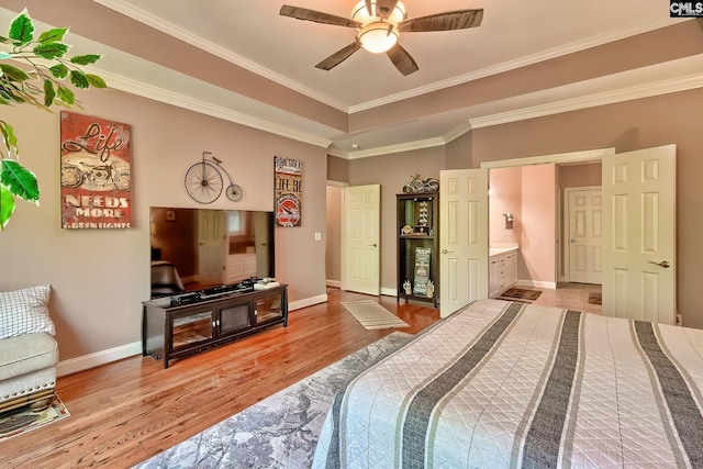 bedroom featuring crown molding, baseboards, and light wood-style flooring