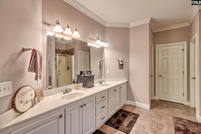 bathroom featuring crown molding, double vanity, a sink, and a stall shower