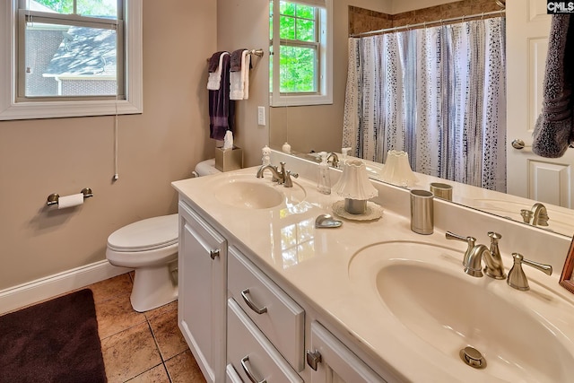 full bath with baseboards, a sink, tile patterned flooring, and toilet