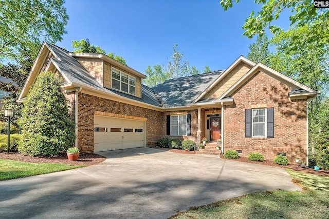 view of front of home featuring an attached garage, concrete driveway, crawl space, and brick siding