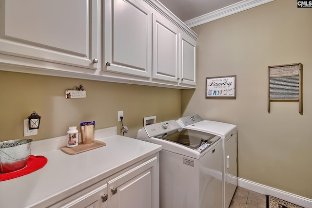 clothes washing area with cabinet space, light tile patterned flooring, crown molding, baseboards, and washer and clothes dryer