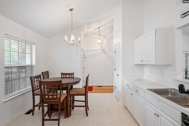 dining room with baseboards, a notable chandelier, and marble finish floor