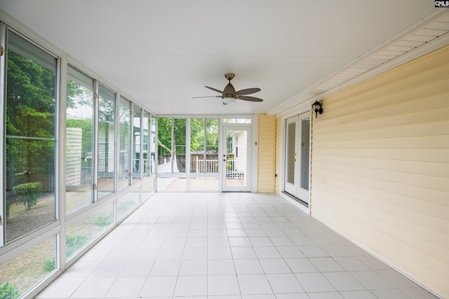 unfurnished sunroom with french doors and ceiling fan