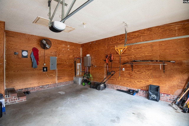 garage featuring a garage door opener, electric panel, and wood walls