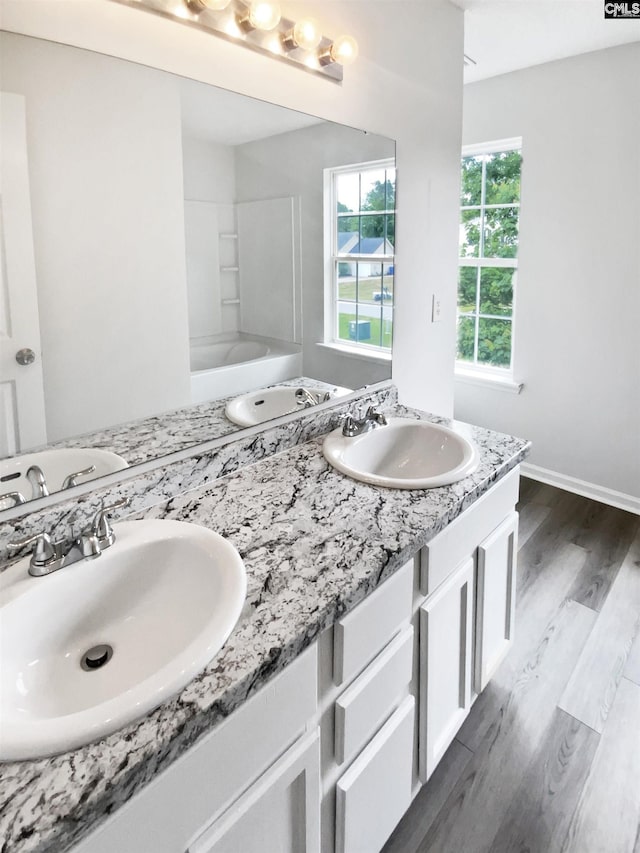 6 Sawdust Ct, Columbia, SC 29209 - full bath with a sink, baseboards, double vanity, and wood finished floors