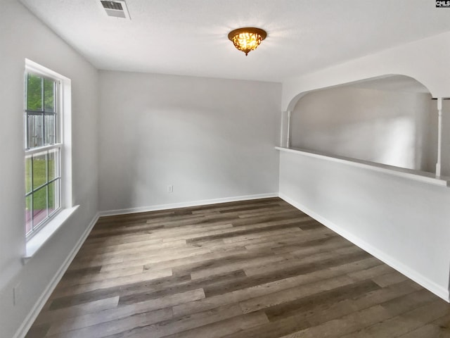 6 Sawdust Ct, Columbia, SC 29209 - unfurnished room featuring visible vents, arched walkways, baseboards, and wood finished floors