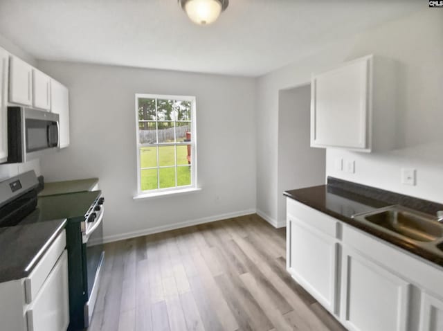6 Sawdust Ct, Columbia, SC 29209 - kitchen featuring white cabinets, dark countertops, stainless steel appliances, baseboards, and light wood-type flooring